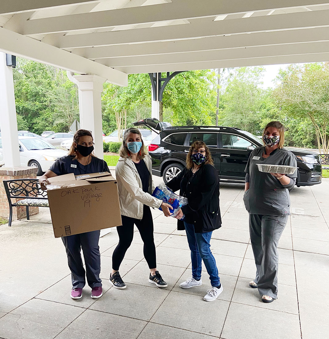 Elizabeth Sconzert delivers meals to Oak Park Village