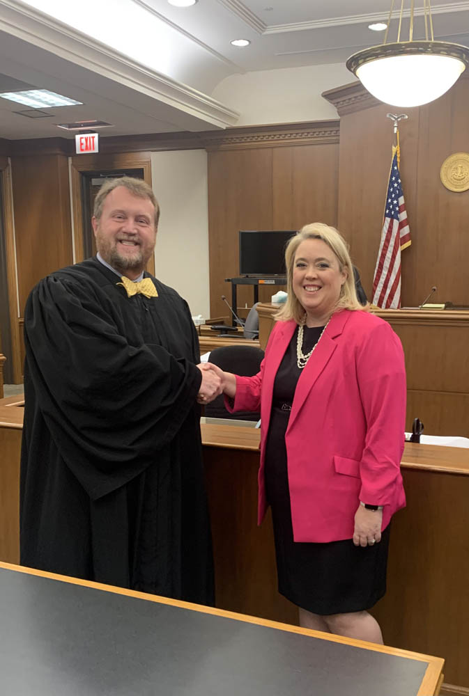 2024 President Kristen Stanley-Wallace, with Judge William Burris, making the oath that promises to fulfill her responsibilities to the Bar Association with loyalty and care.